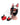 Black and red leather puppy hood mask with removable red and black muzzle accessory detail shot.