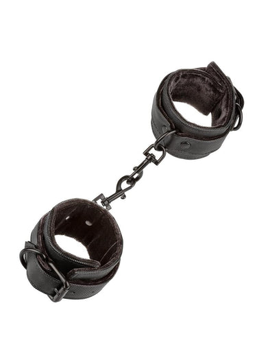 Black plush padded wrist cuffs connected by chain link, shown as a pair on white background.