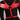 Red faux leather angel wing body harness with silver O-rings and stud accents worn on model.