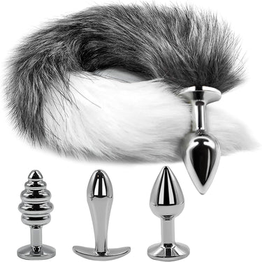 Gray and white fox tail butt plug with three silver metal anal plugs in small medium and large sizes product flat lay.