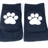 Black padded knee pads with white paw print design pair front view on white background.