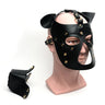 Black leather bondage puppy hood mask with gold studs, ears and removable muzzle on mannequin head.