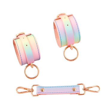 Pastel rainbow wrist cuffs shown with spreader bar and rose gold D-ring connectors on white background.