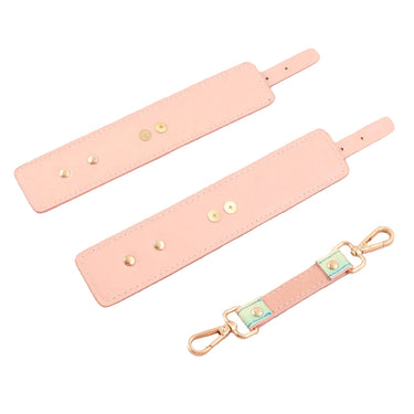 Close-up of pastel holographic leather cuff strap showing adjustable buckle and rose gold hardware.