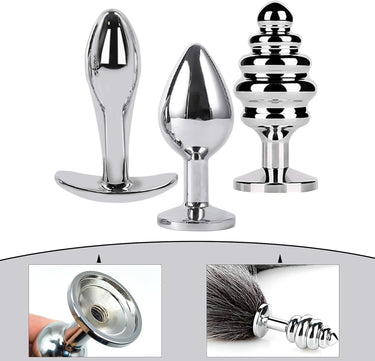 Silver metal butt plug set of three with ribbed stacked and tapered designs plus fox tail detail flat lay.