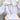 White faux leather angel wing body harness with silver O-rings worn on model back view.