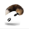 Brown fox fur tail with black silicone vibrating butt plug and remote, shown on white background.